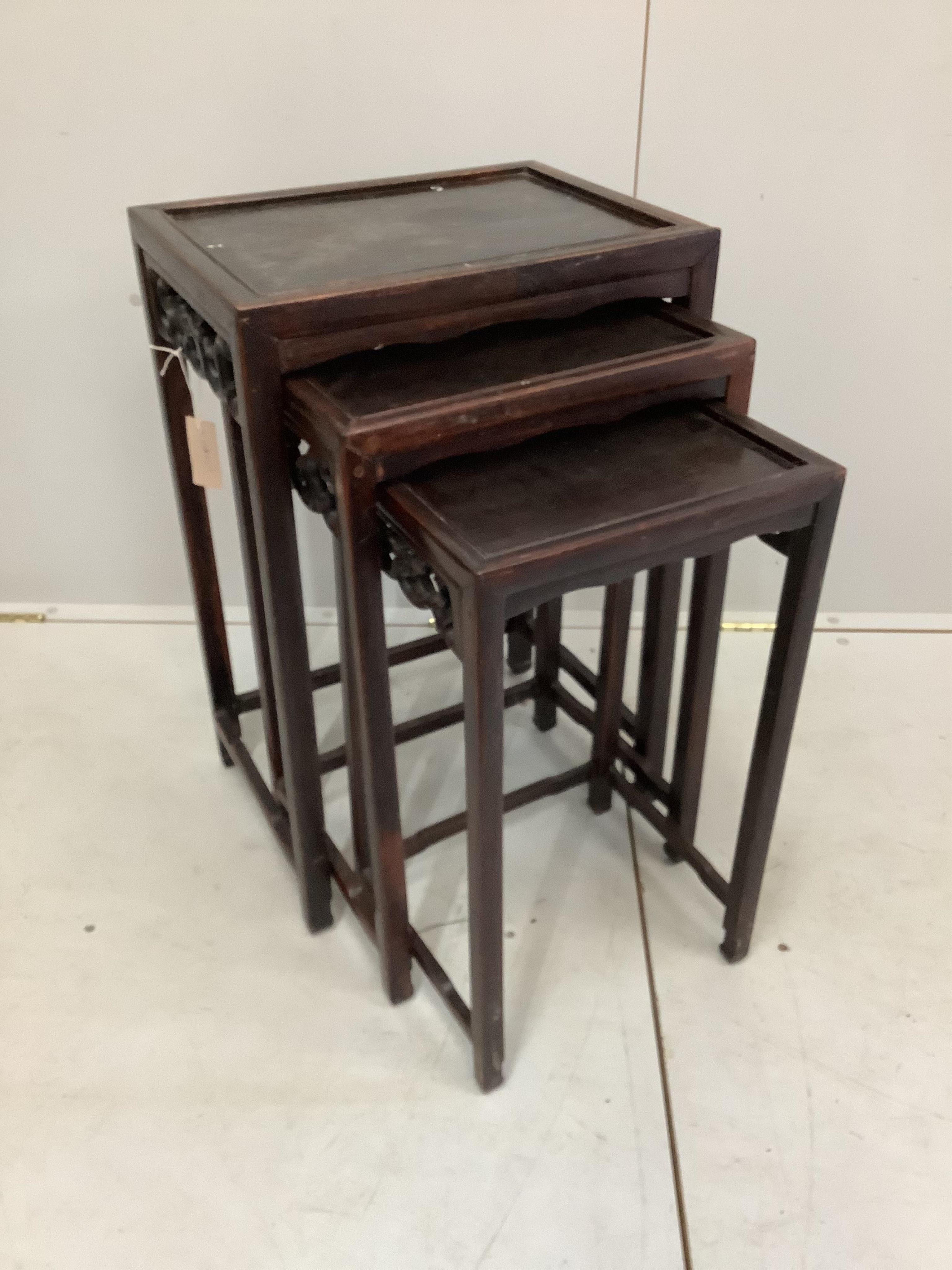 A nest of three Chinese rectangular hardwood tables, width 44cm, depth 33cm, height 66cm